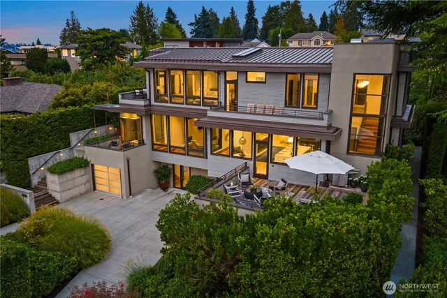 aerial view of a house with pool and chairs