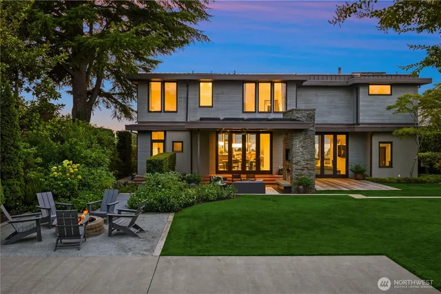 front view of a brick house with a yard