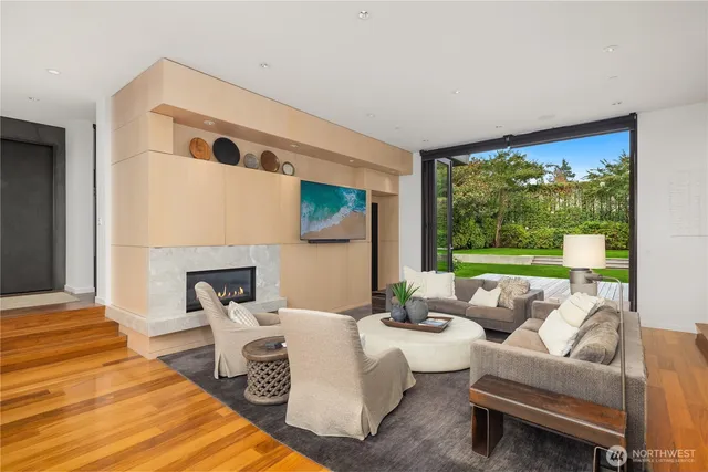 a living room with furniture and a fireplace