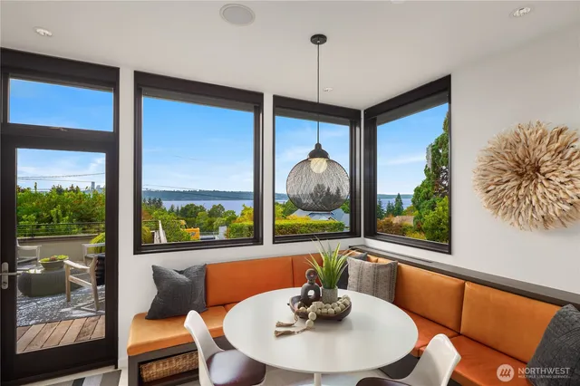 a view of a dining room with furniture window and wooden floor