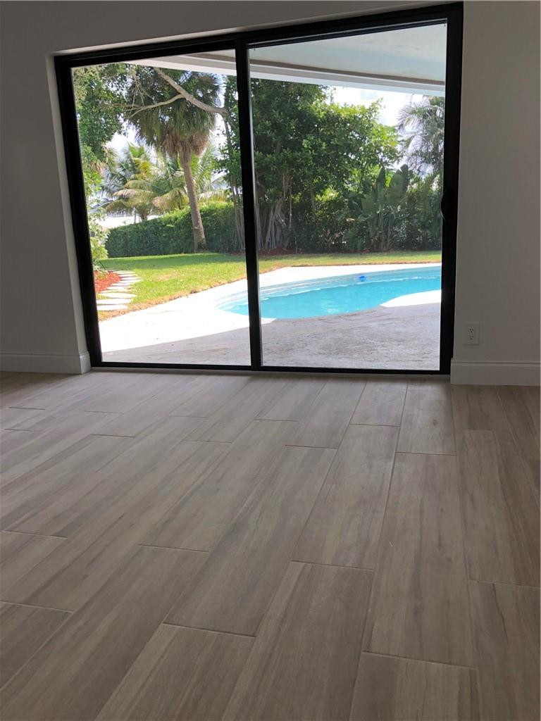 1230 Mulberry Way Boca Raton, FL 33486 - Photo 25 of 31 a view of a glass door with a large window