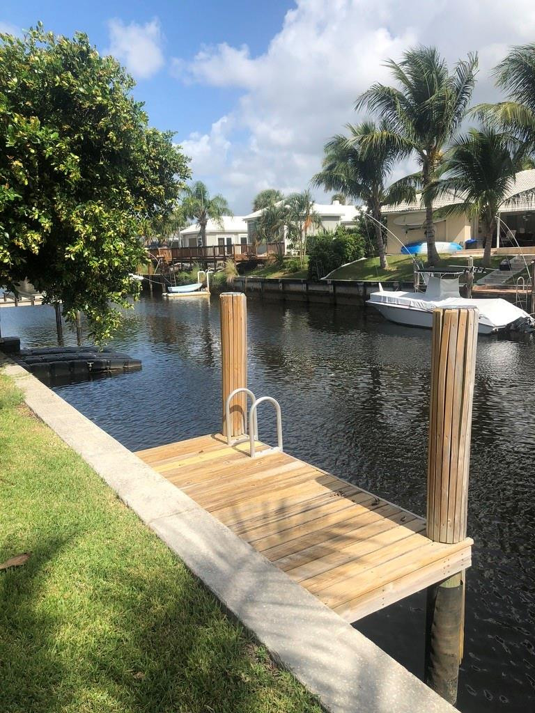1230 Mulberry Way Boca Raton, FL 33486 - Photo 10 of 31 a view of a lake with houses