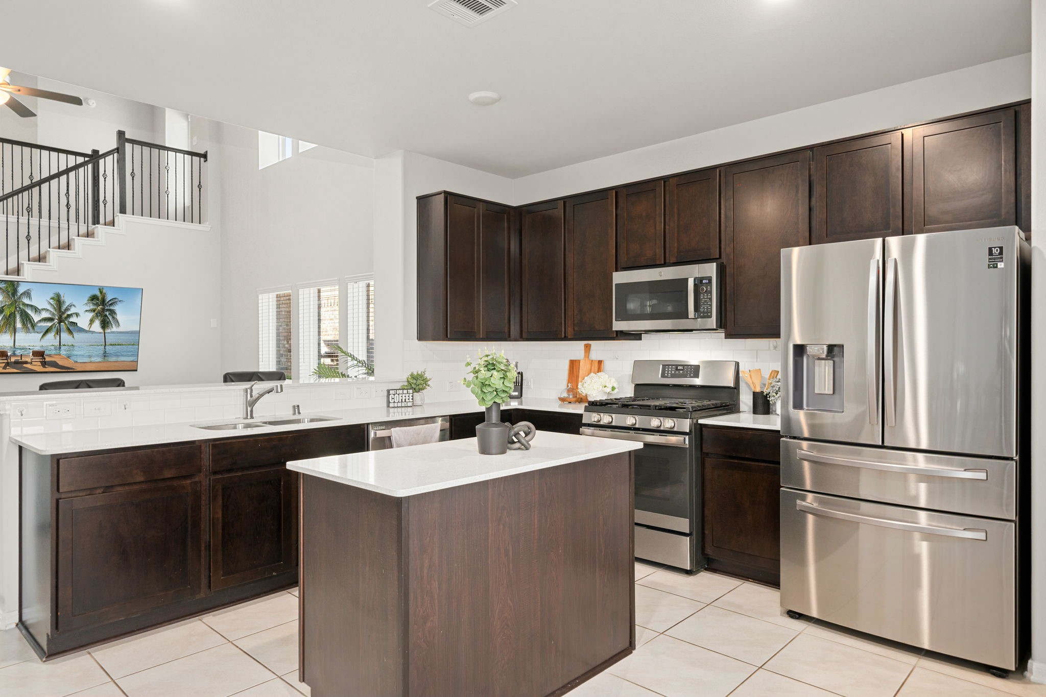 5007 Chimney Swift Lane Baytown, TX 77521 - Photo 5 of 33 Gourmet kitchen finished with neutral countertops, center island, stainless steel appliances, and ample cabinetry.