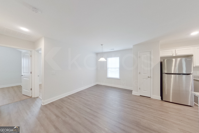 231 Western Red Cedar Drive Springfield, GA 31329 - Photo 10 of 26 a view of a kitchen with a sink and a refrigerator