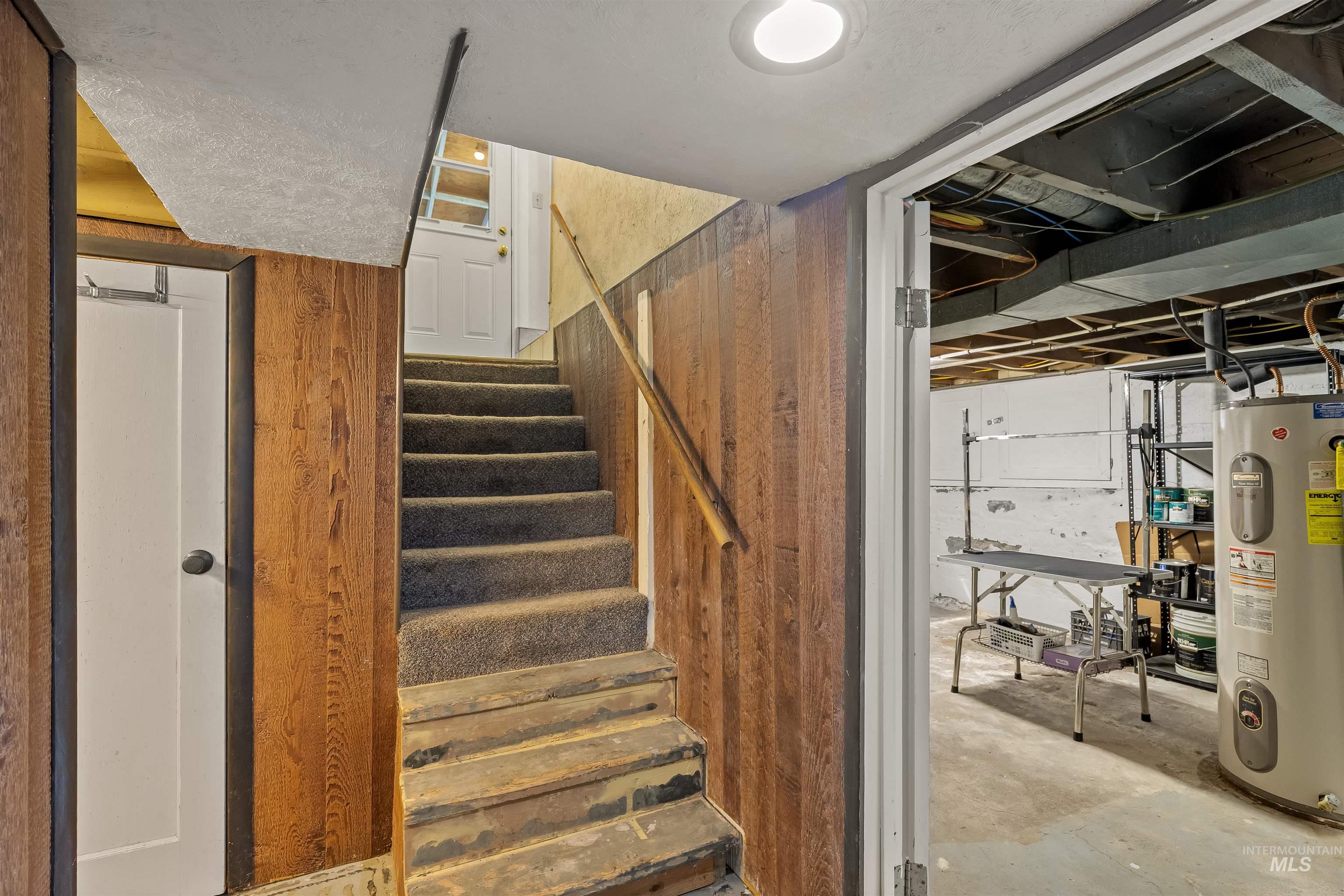 924 N Street Lewiston, ID 83501 - Photo 37 of 46 Carpeted staircase with wood paneling and a handrail
