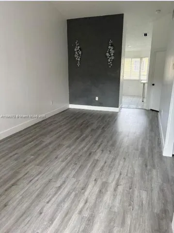 a view of a livingroom with wooden floor