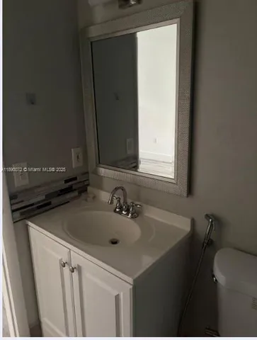 a bathroom with a sink and a toilet