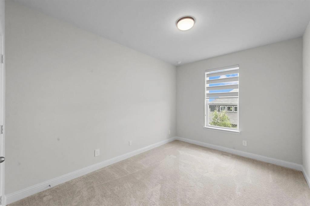 10969 Coastal Violet Road Frisco, TX 75035 - Photo 13 of 30 Carpeted empty room with baseboards