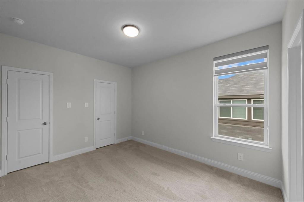 10969 Coastal Violet Road Frisco, TX 75035 - Photo 14 of 30 Spare room with light colored carpet and baseboards