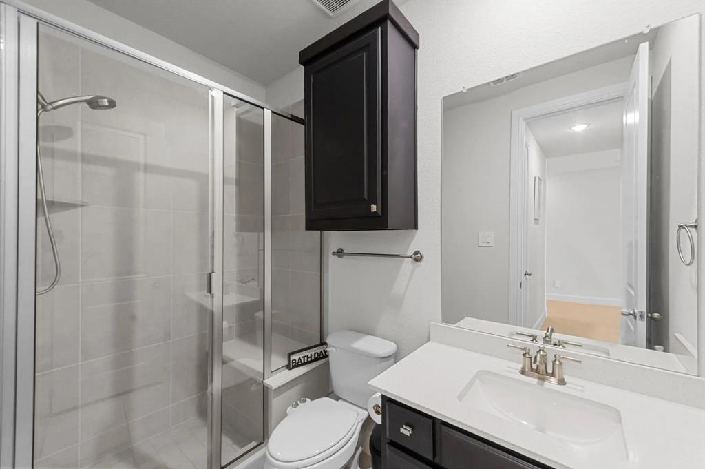 10969 Coastal Violet Road Frisco, TX 75035 - Photo 18 of 30 Full bath with a stall shower and vanity