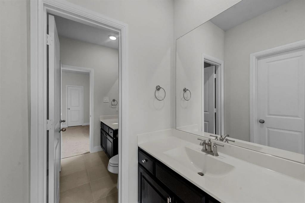 10969 Coastal Violet Road Frisco, TX 75035 - Photo 21 of 30 Bathroom featuring vanity and tile patterned floors