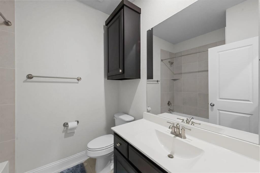 10969 Coastal Violet Road Frisco, TX 75035 - Photo 25 of 30 Bathroom featuring vanity and shower / bath combination