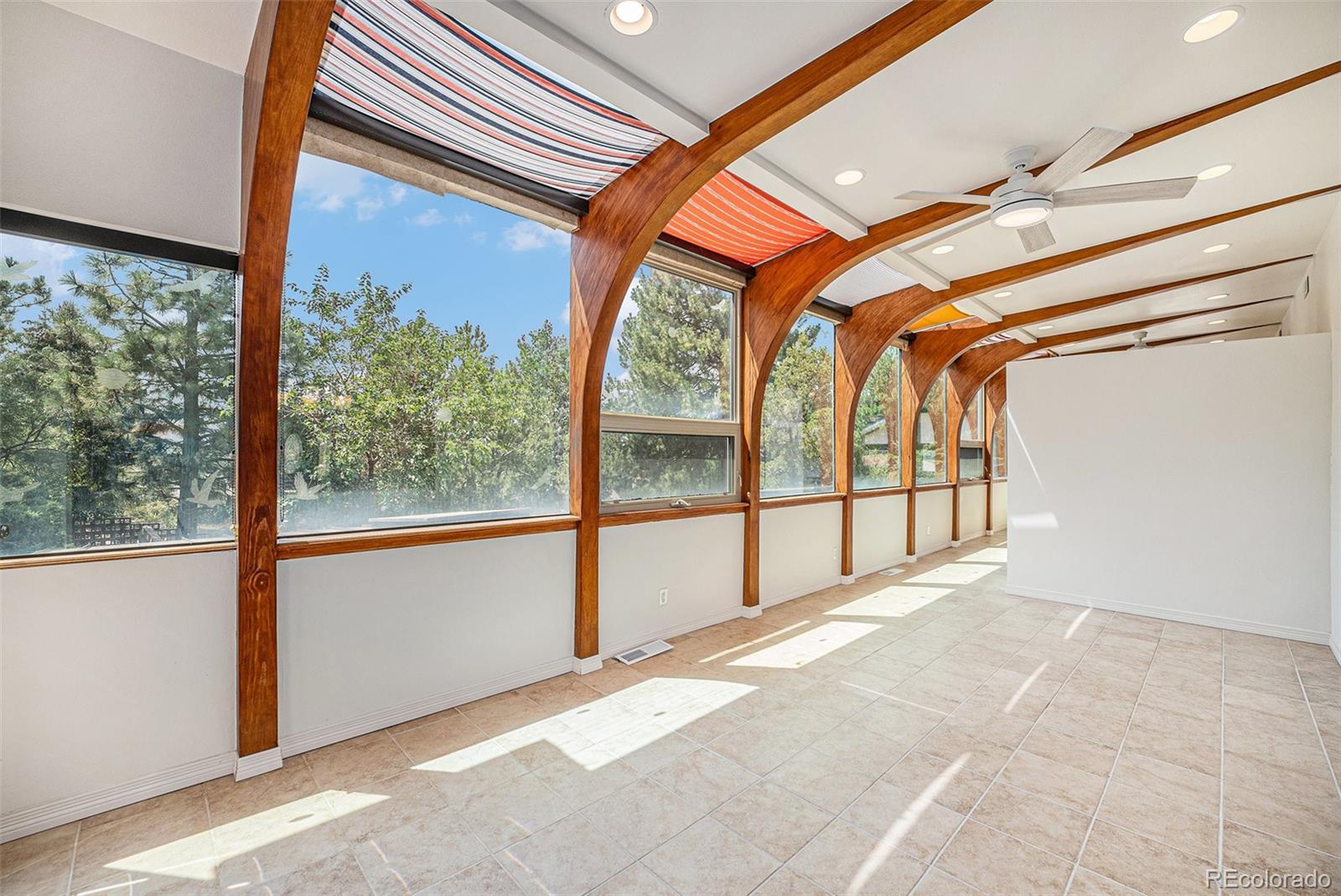 11802 West 77th Drive Arvada, CO 80005 - Photo 16 of 45 a view of an empty room with a window