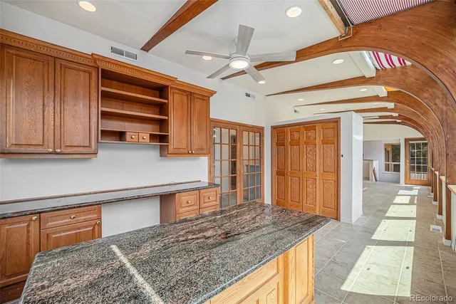 a spacious bathroom with a tub and large window