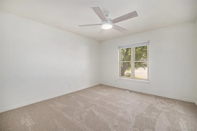 a view of a kitchen with a sink and cabinets