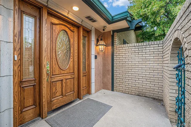a view of a door and wooden walls
