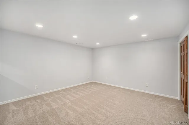 a bathroom with a granite countertop sink toilet a mirror and shower