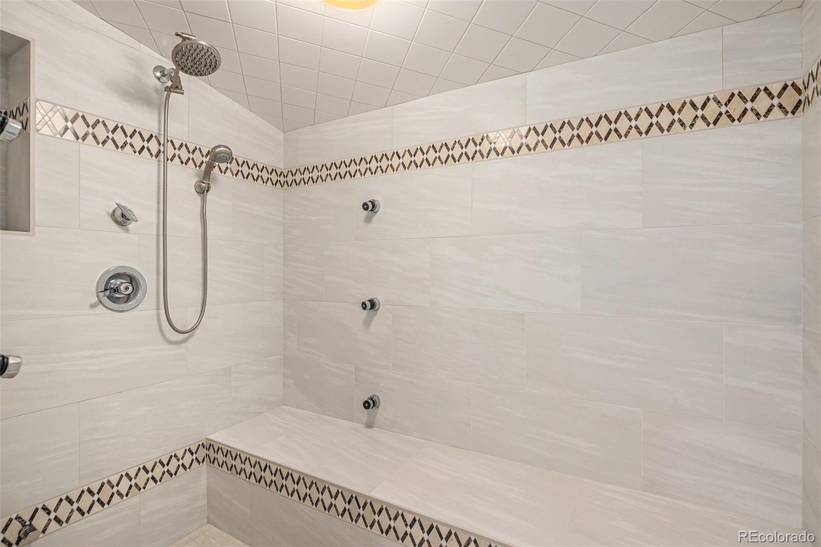 11802 West 77th Drive Arvada, CO 80005 - Photo 34 of 45 a bathroom with a shower