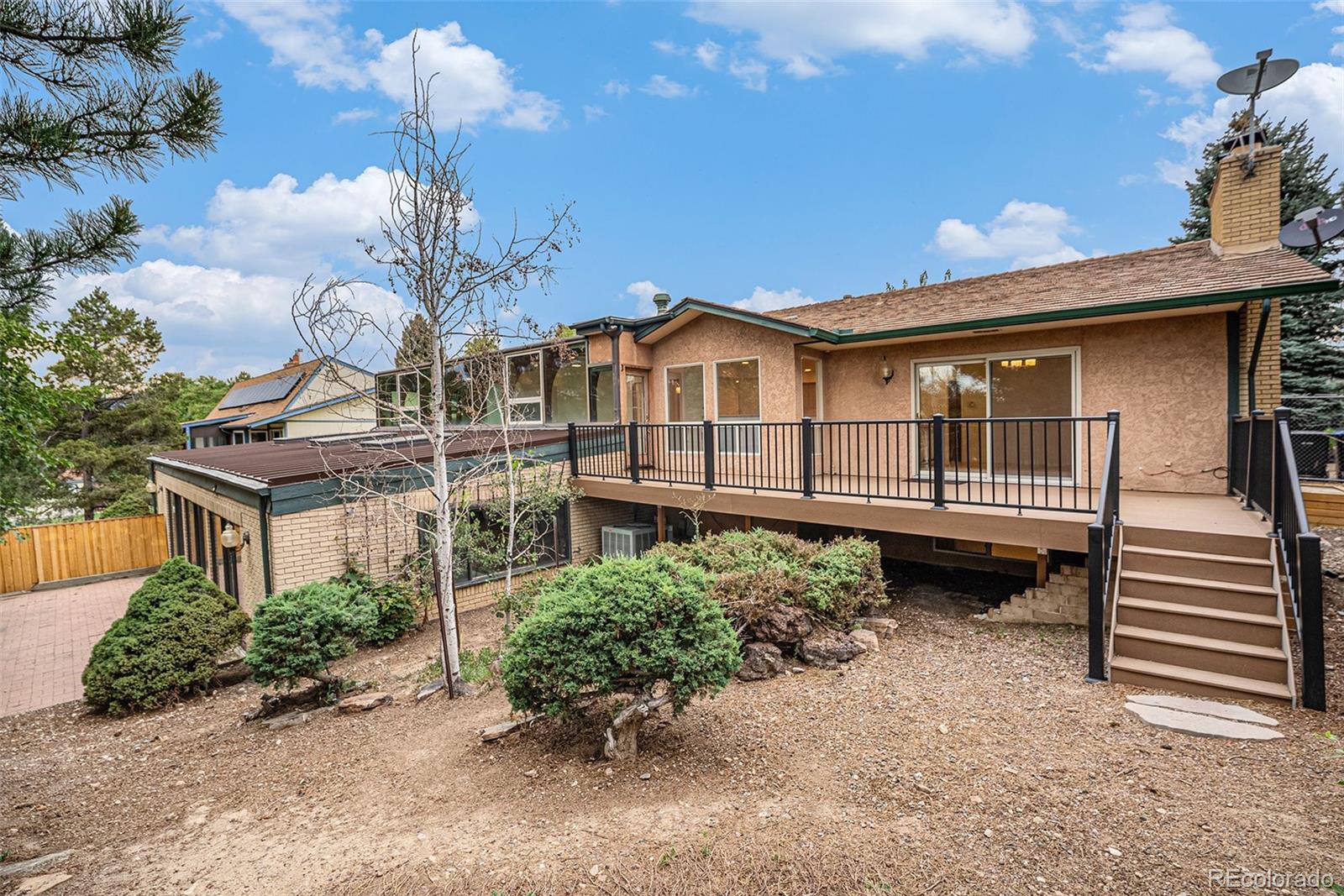 11802 West 77th Drive Arvada, CO 80005 - Photo 39 of 45 a house view with a garden space