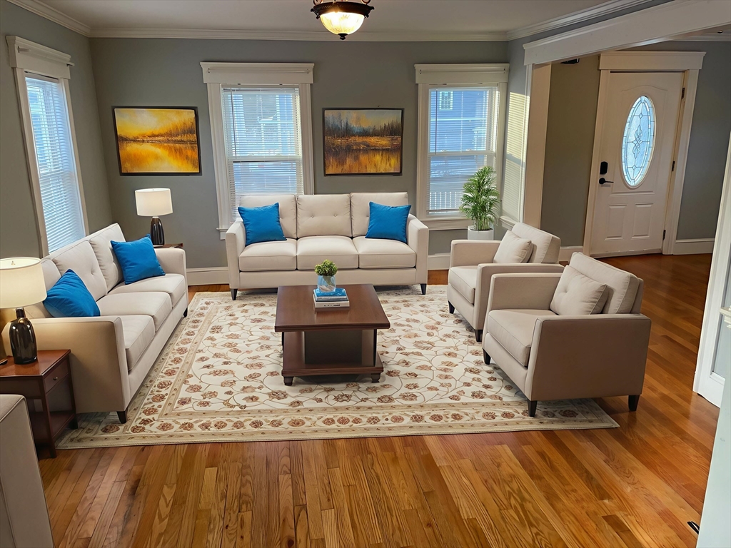 6 Brattle Street Worcester, MA 01606 - Photo 3 of 20 a living room with couches rug and a large window