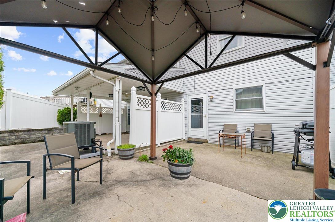 326 Chestnut Street Slatington, PA 18080 - Photo 22 of 28 a view of a patio with table and chairs and potted plants