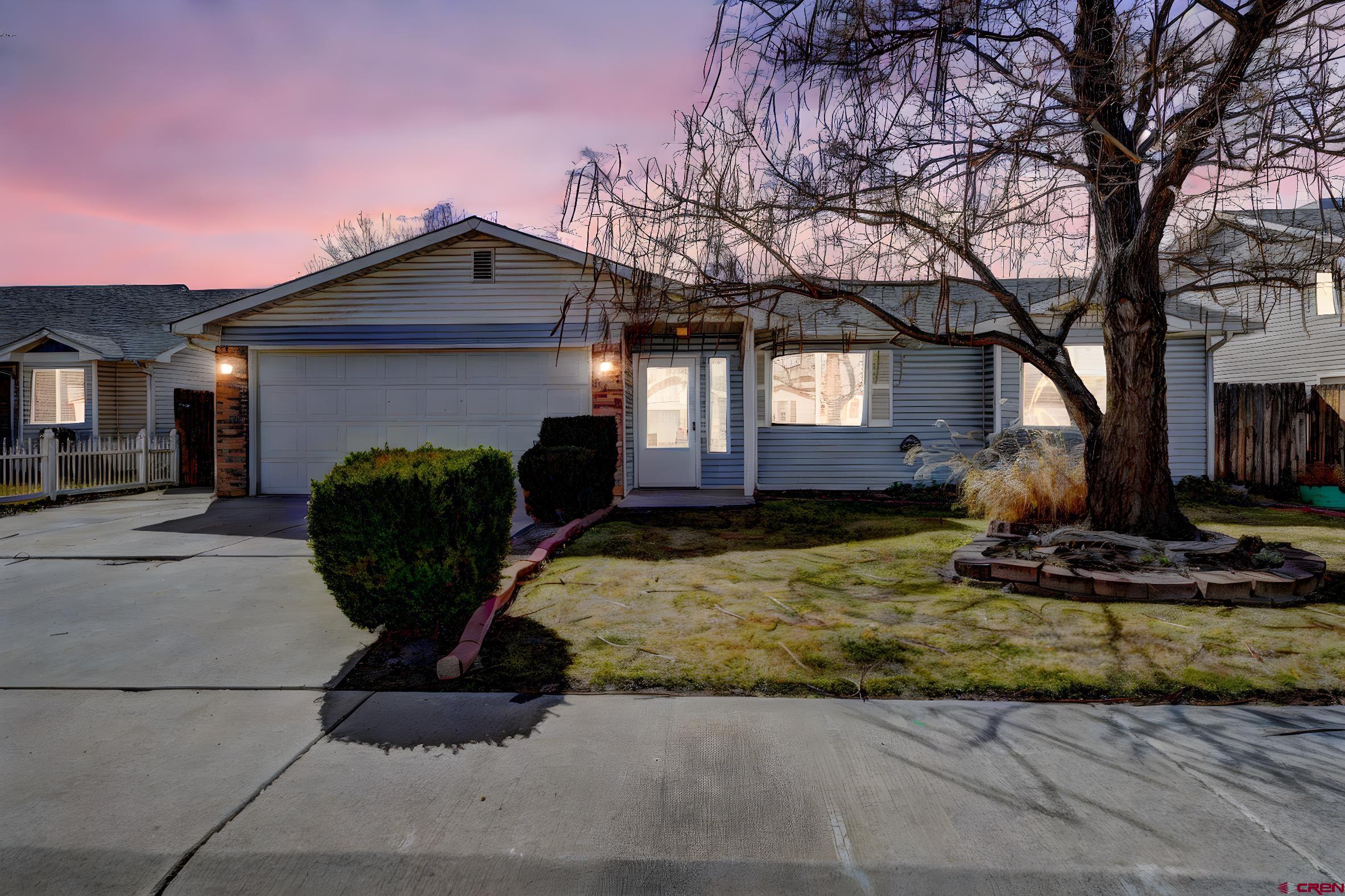 3119 D 3/4 Road Grand Junction, CO 81504 - Photo 1 of 31 a view of a house with backyard and trees