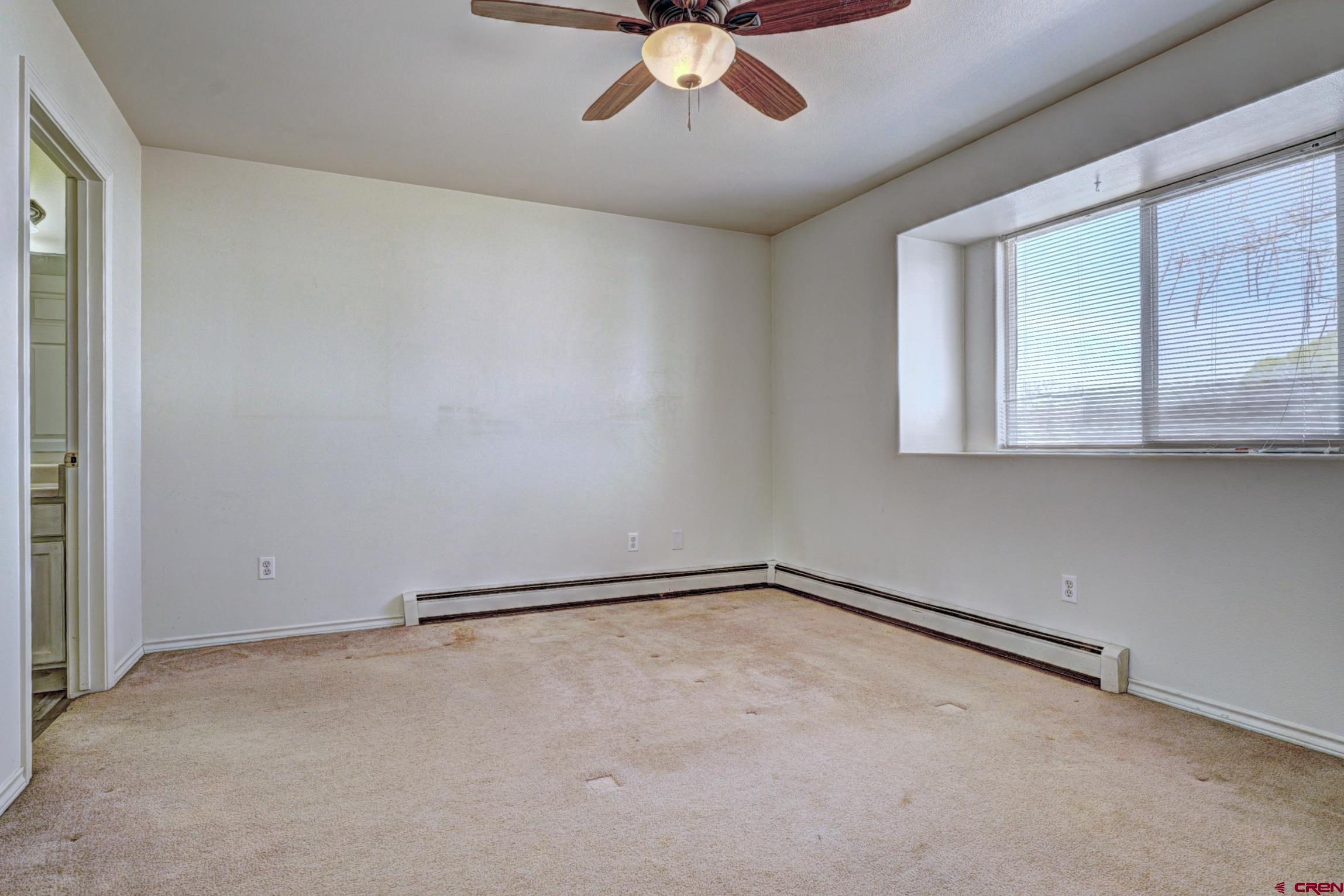 3119 D 3/4 Road Grand Junction, CO 81504 - Photo 14 of 31 a view of an empty room with a window