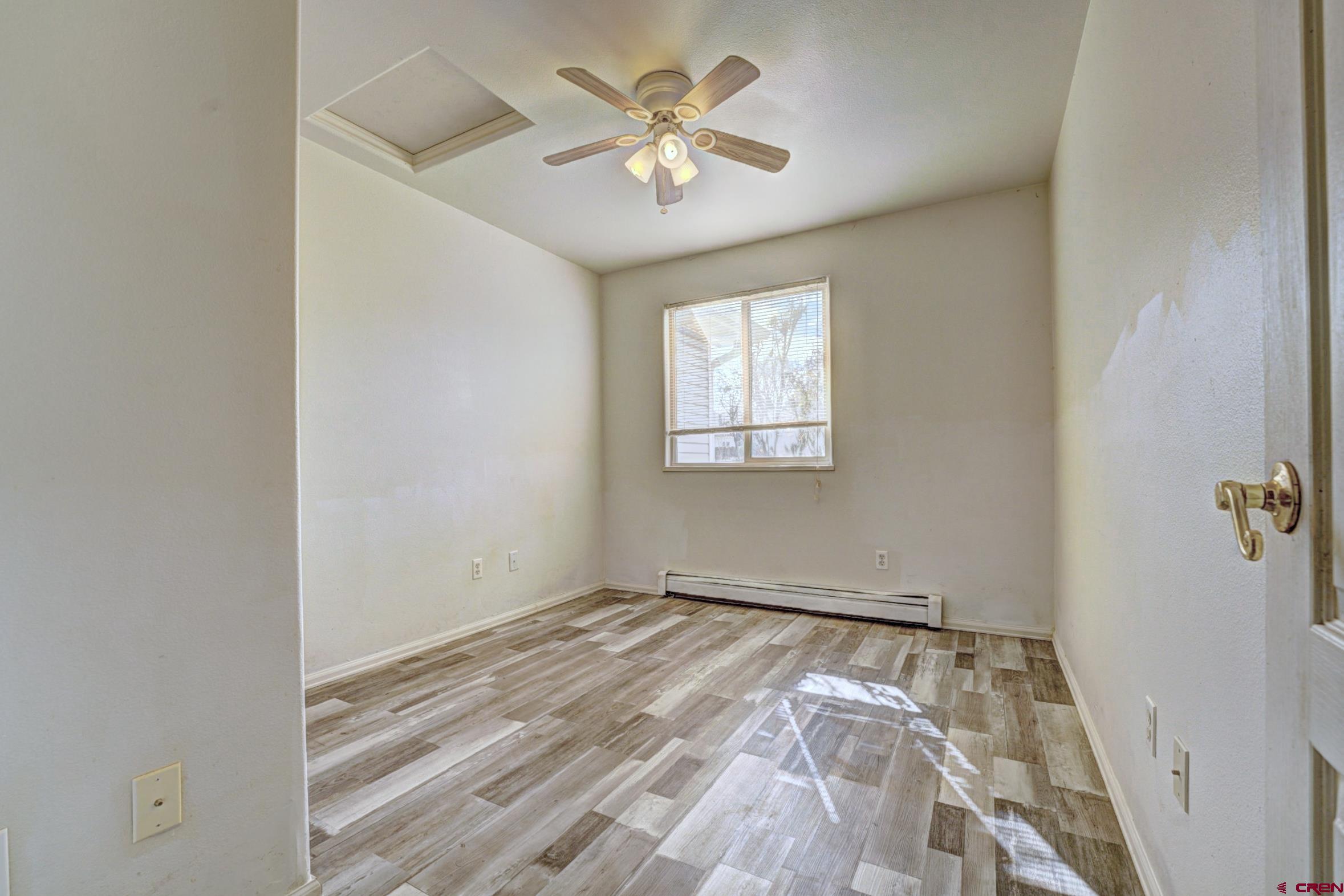 3119 D 3/4 Road Grand Junction, CO 81504 - Photo 17 of 31 an empty room with windows and fan