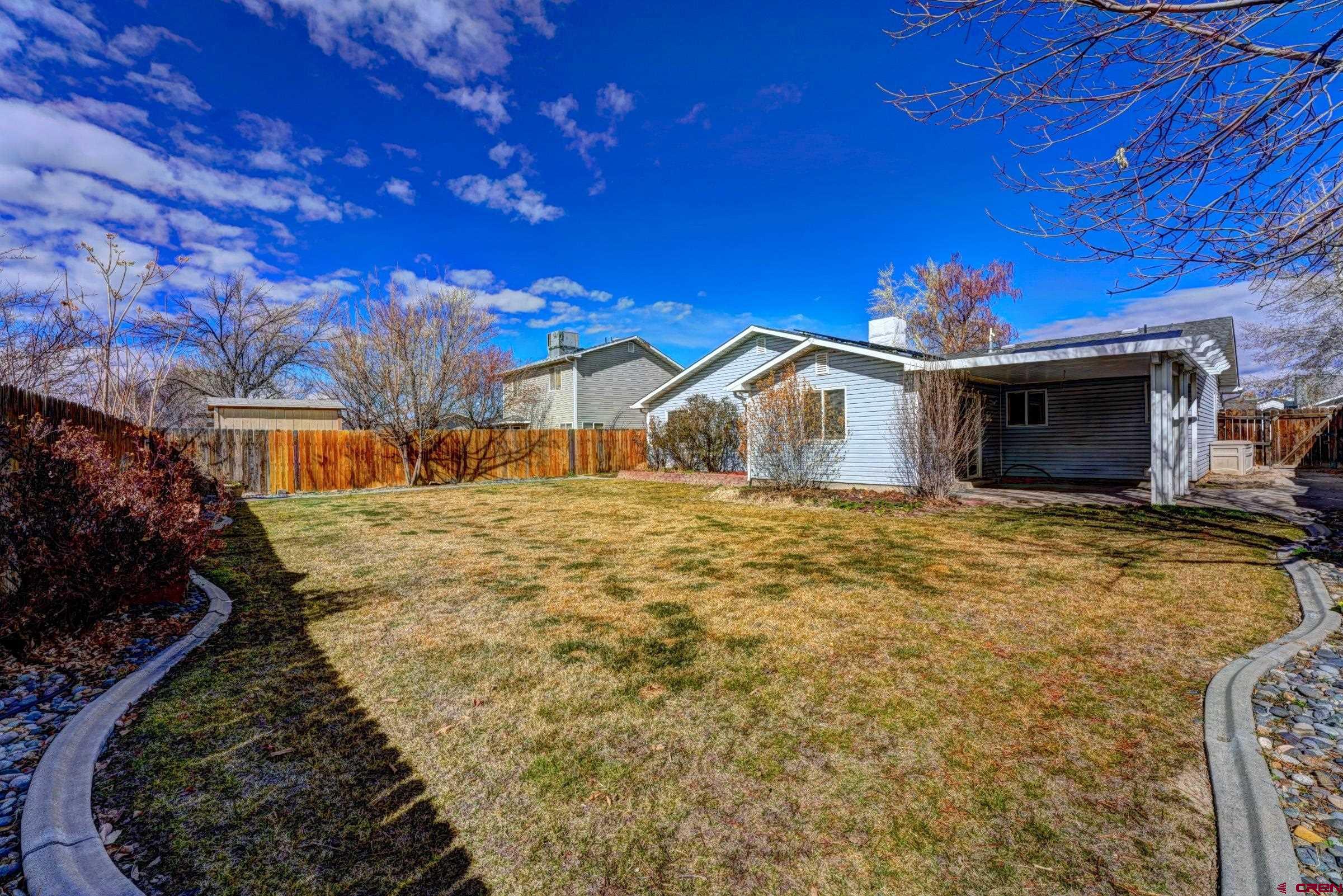 3119 D 3/4 Road Grand Junction, CO 81504 - Photo 26 of 31 a view of a house with a yard