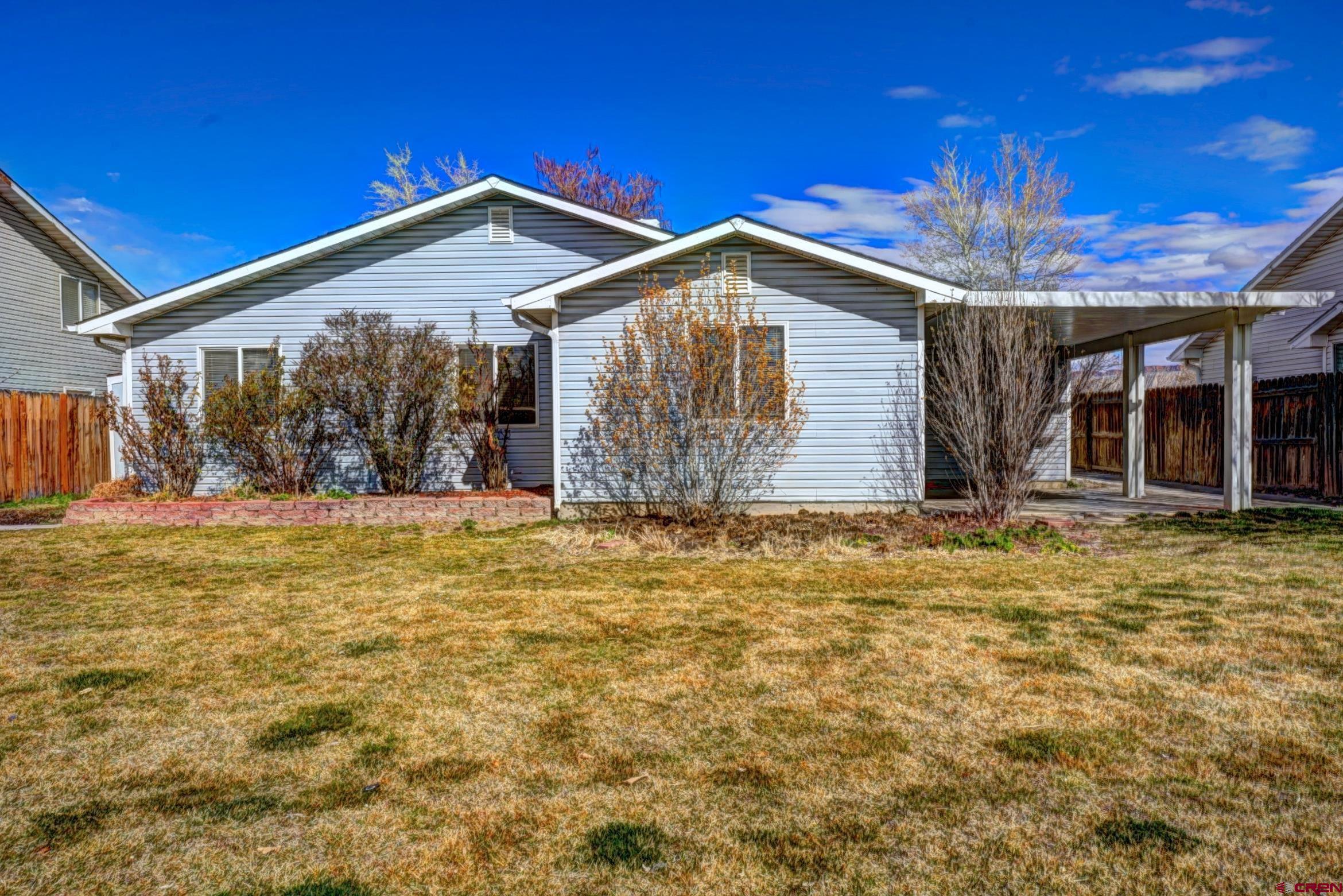 3119 D 3/4 Road Grand Junction, CO 81504 - Photo 28 of 31 a view of house with yard