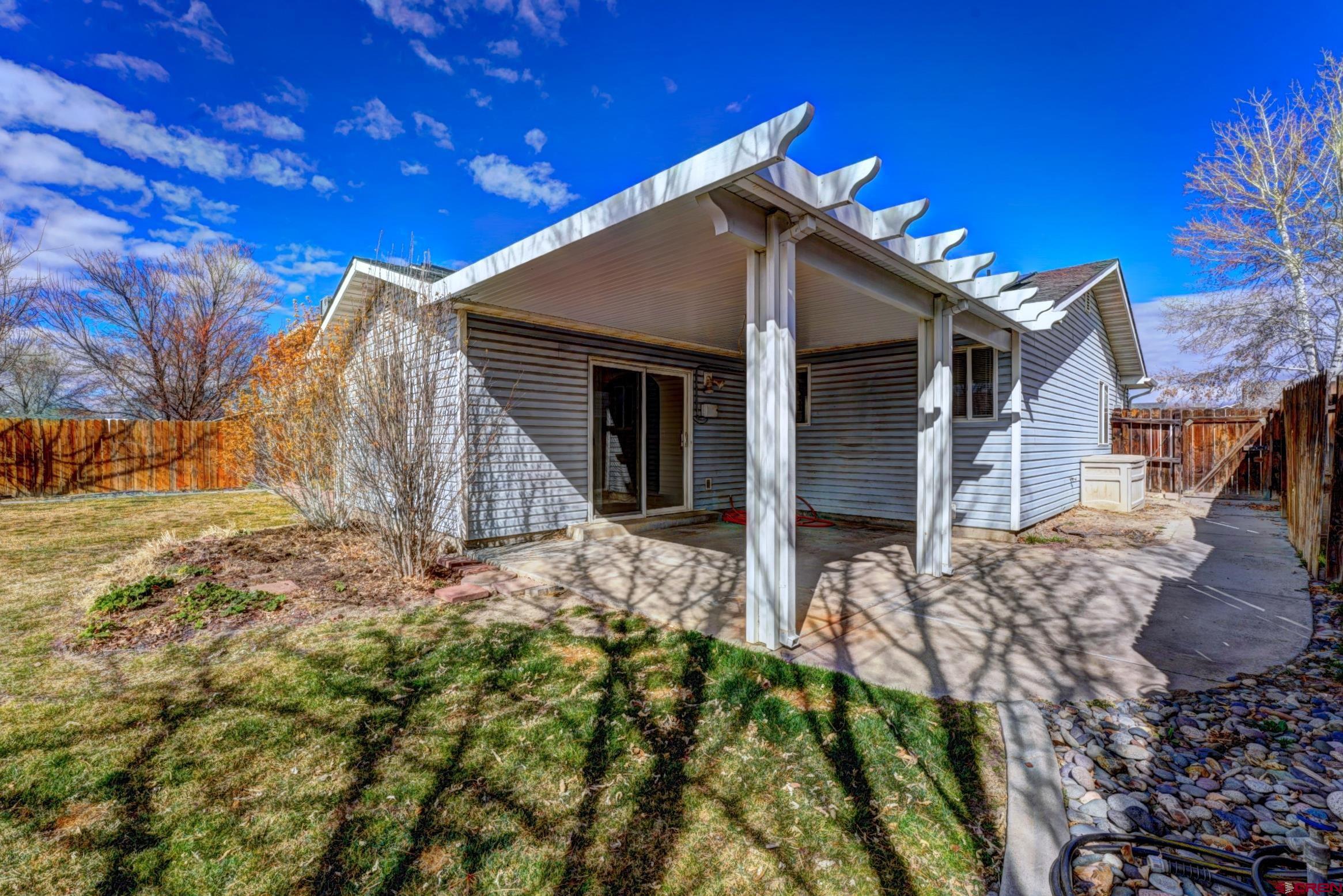 3119 D 3/4 Road Grand Junction, CO 81504 - Photo 30 of 31 a house view with a backyard space