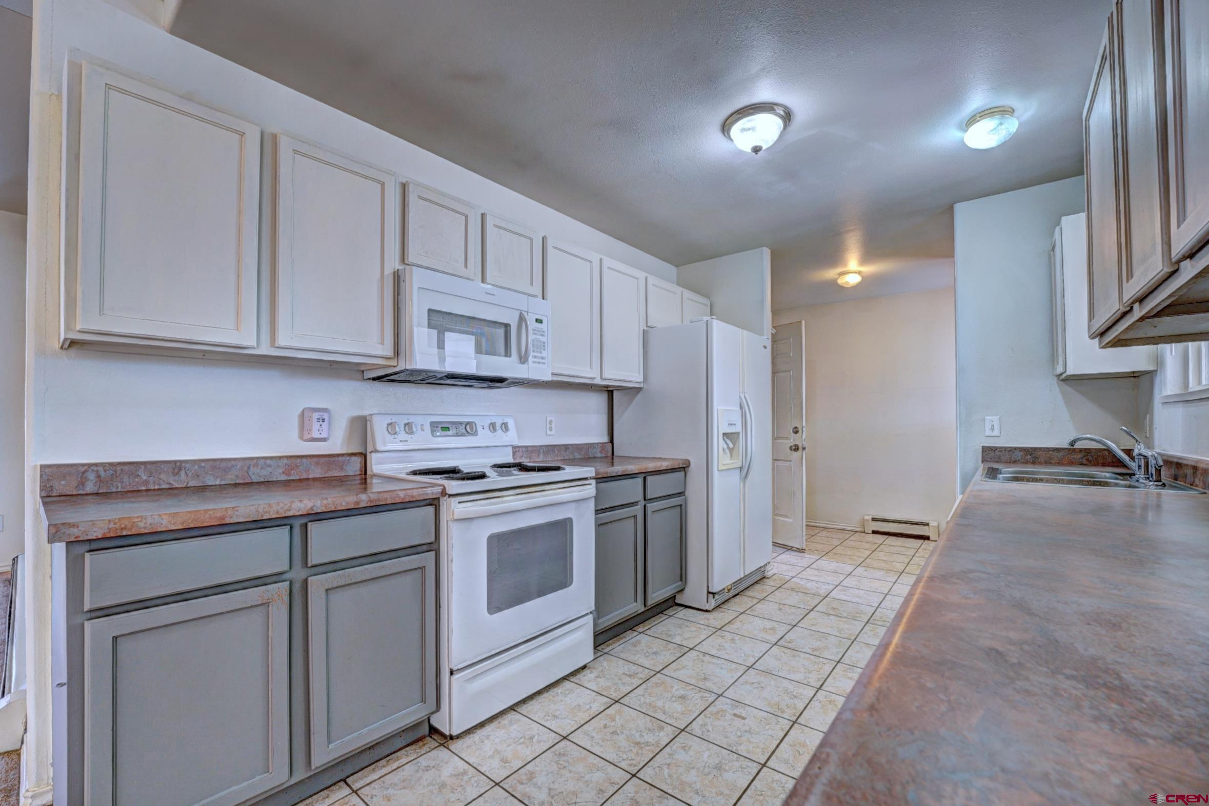 3119 D 3/4 Road Grand Junction, CO 81504 - Photo 6 of 31 a kitchen with stainless steel appliances granite countertop a stove and a sink
