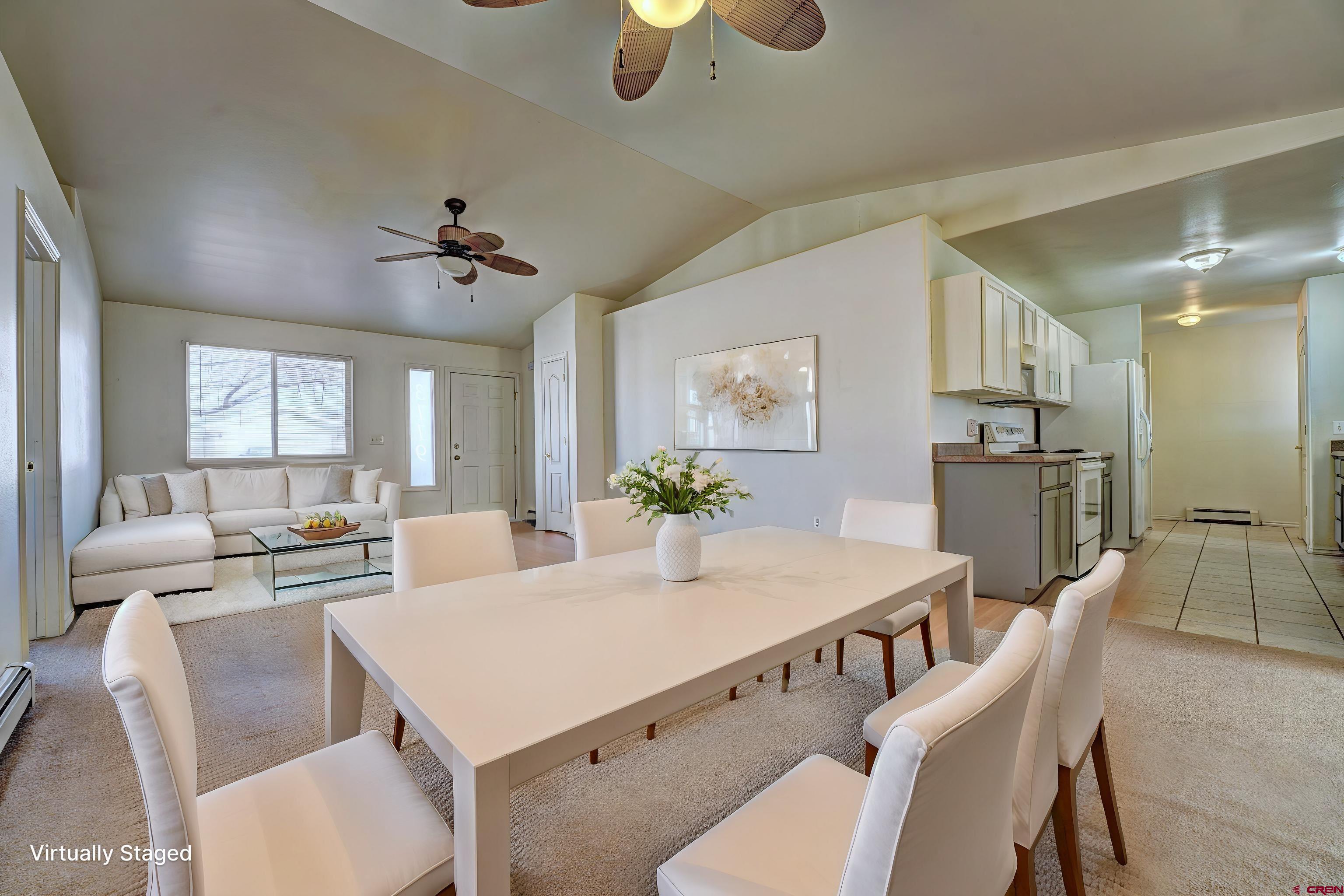 3119 D 3/4 Road Grand Junction, CO 81504 - Photo 9 of 31 a view of a dining room with furniture and a chandelier