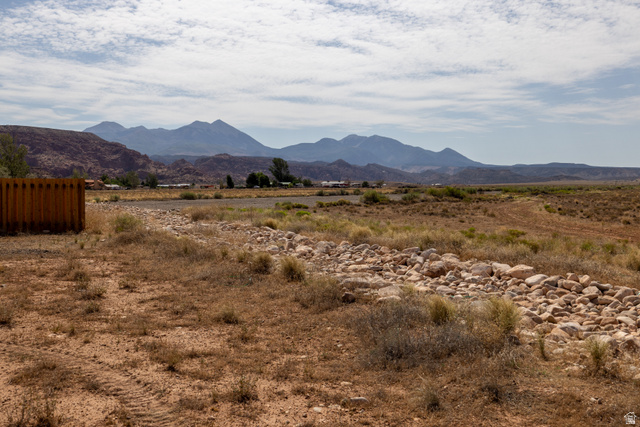 212 Lidia Circle, Unit 17 Moab, UT 84532 - Photo 16 of 24 Expansive desert landscape featuring distant mountains and a clear sky