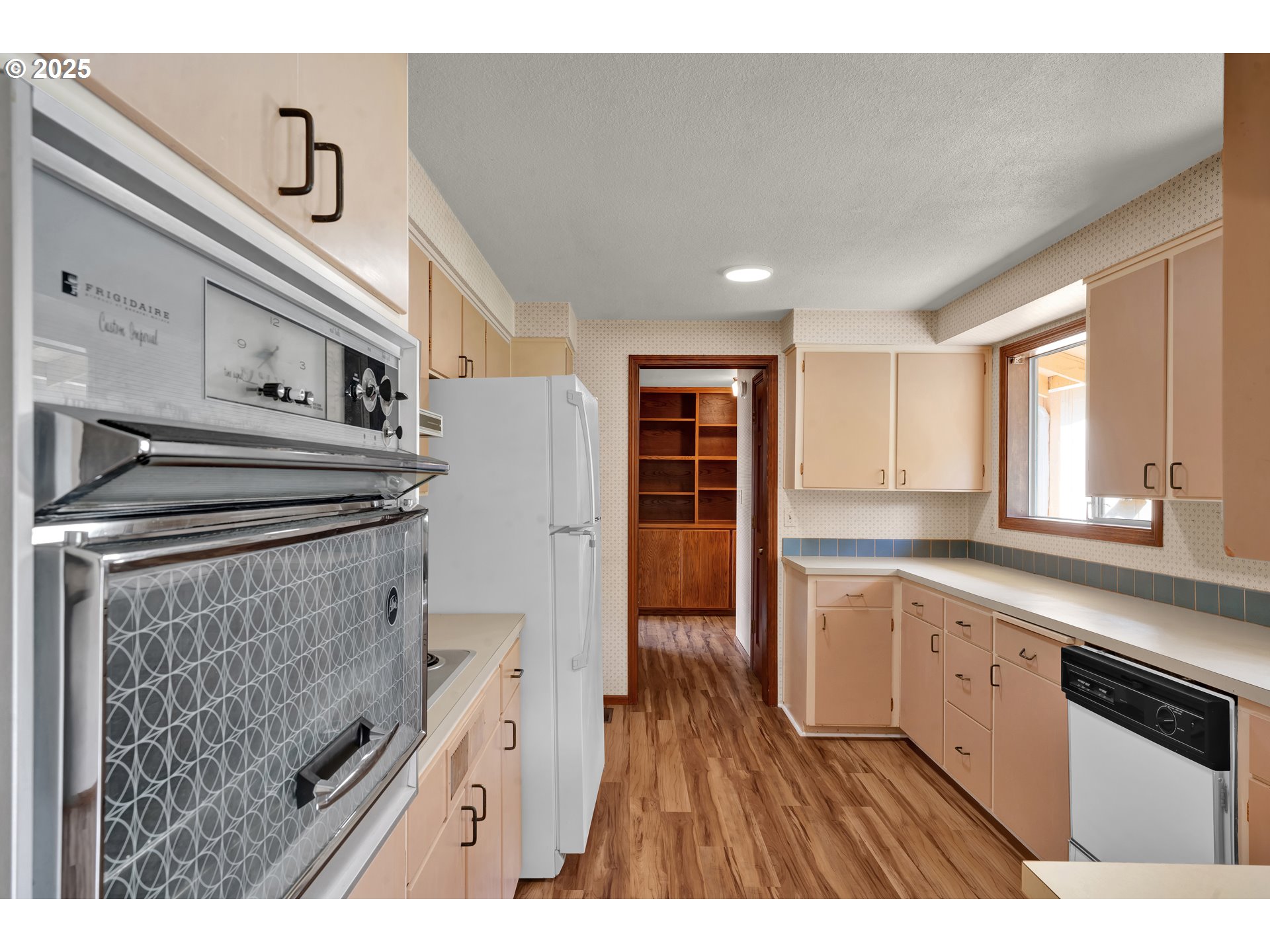 34520 Mathews Road Eugene, OR 97405 - Photo 11 of 42 a kitchen with cabinets and wooden floor