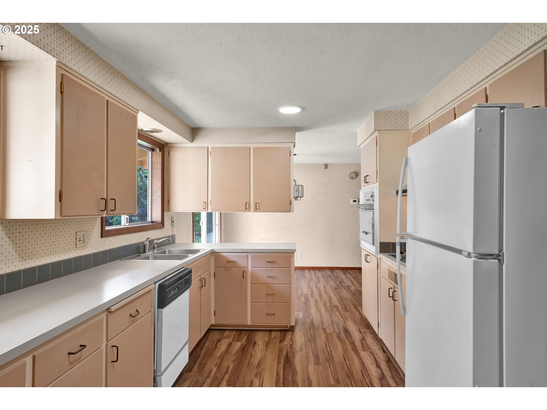 34520 Mathews Road Eugene, OR 97405 - Photo 13 of 42 a kitchen with a refrigerator a sink and cabinets