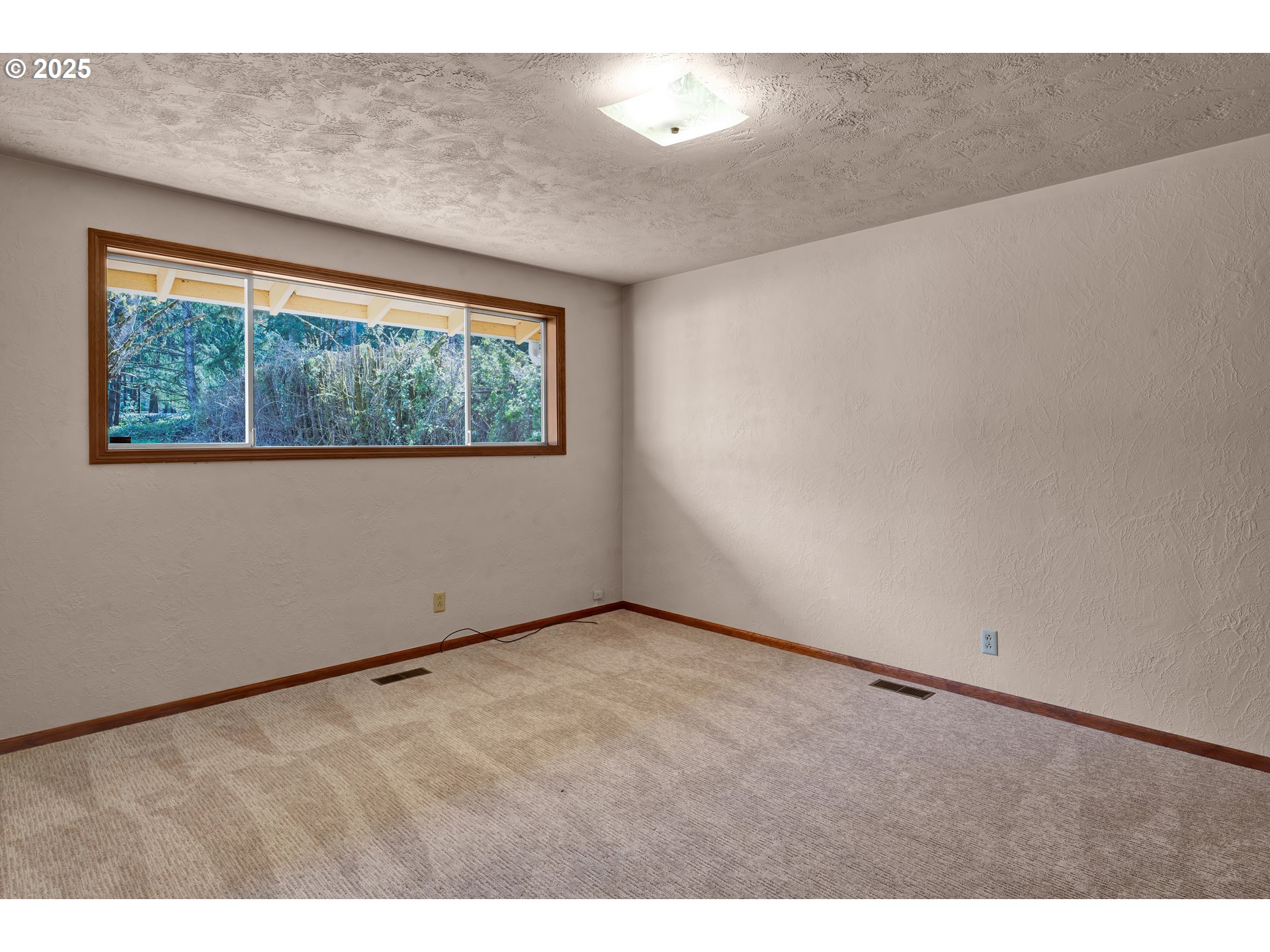 34520 Mathews Road Eugene, OR 97405 - Photo 19 of 42 a view of an empty room with a window