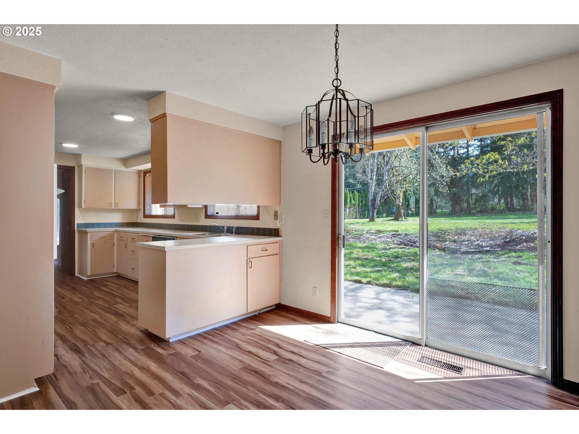 34520 Mathews Road Eugene, OR 97405 - Photo 10 of 42 a kitchen view with wooden floor a kitchen view and stainless steel appliances