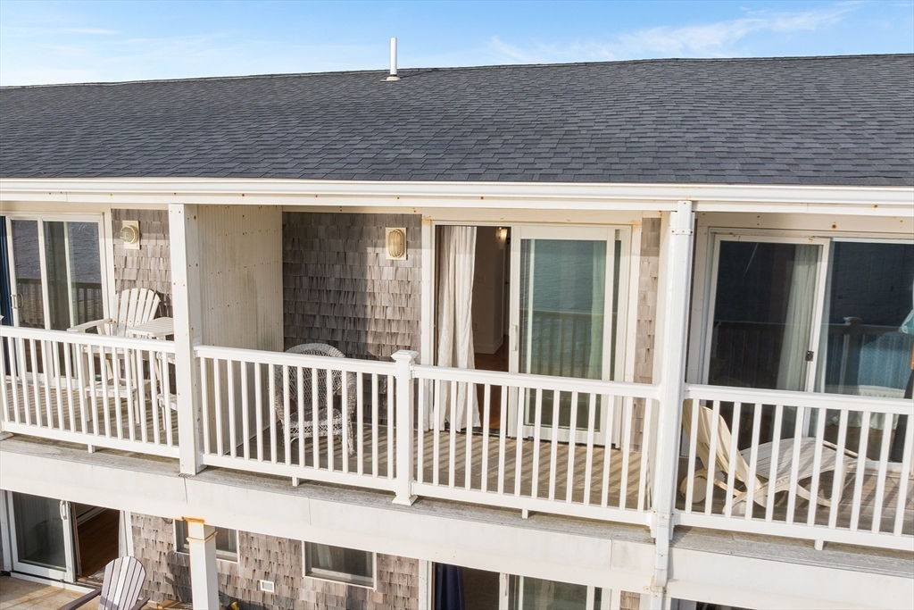 544 Shore Road, Unit 3 Truro, MA 02666 - Photo 3 of 30 a view of a brick house with a deck