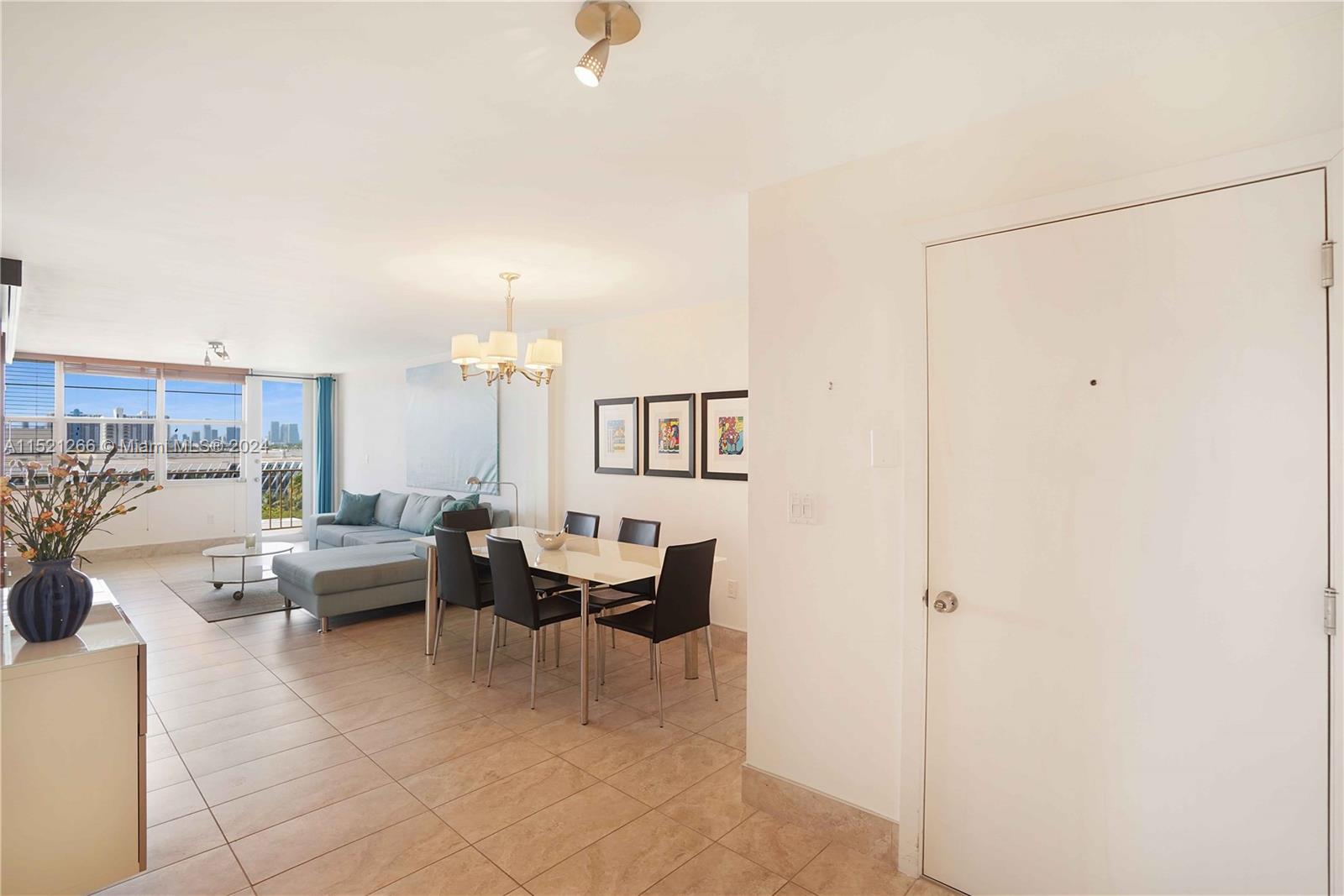 245 18th Street, Unit 902 Miami Beach, FL 33139 - Photo 16 of 54 a living room with furniture and a table