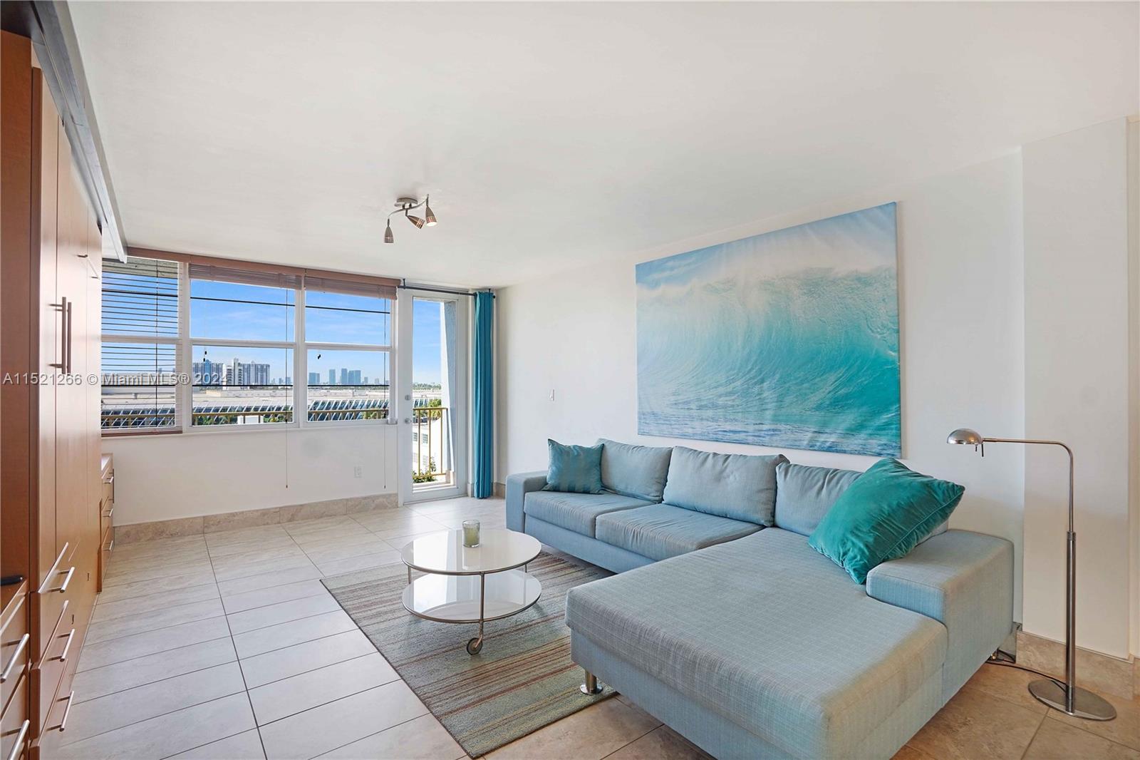 245 18th Street, Unit 902 Miami Beach, FL 33139 - Photo 21 of 54 a living room with furniture and a view of kitchen