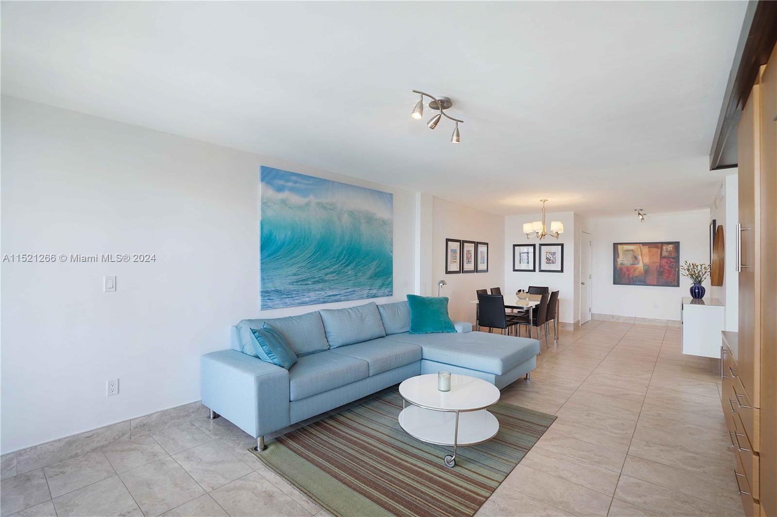 245 18th Street, Unit 902 Miami Beach, FL 33139 - Photo 22 of 54 a living room with furniture and a rug