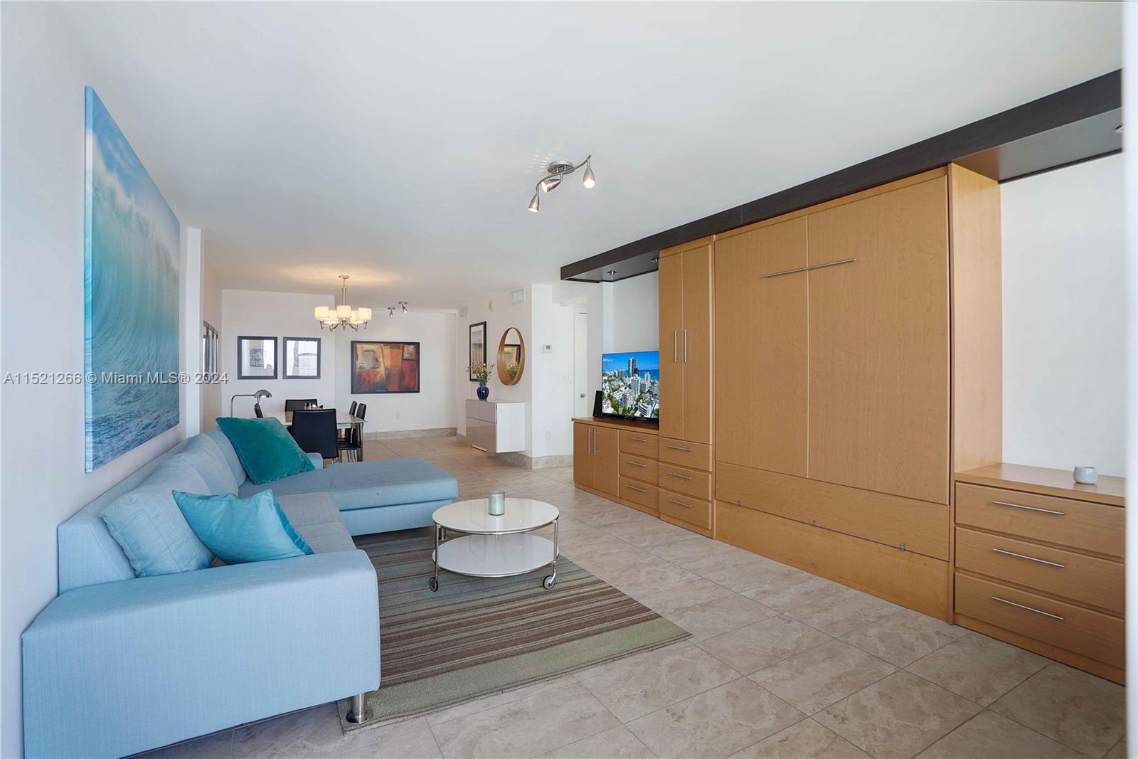 245 18th Street, Unit 902 Miami Beach, FL 33139 - Photo 23 of 54 a living room with furniture and wooden floor