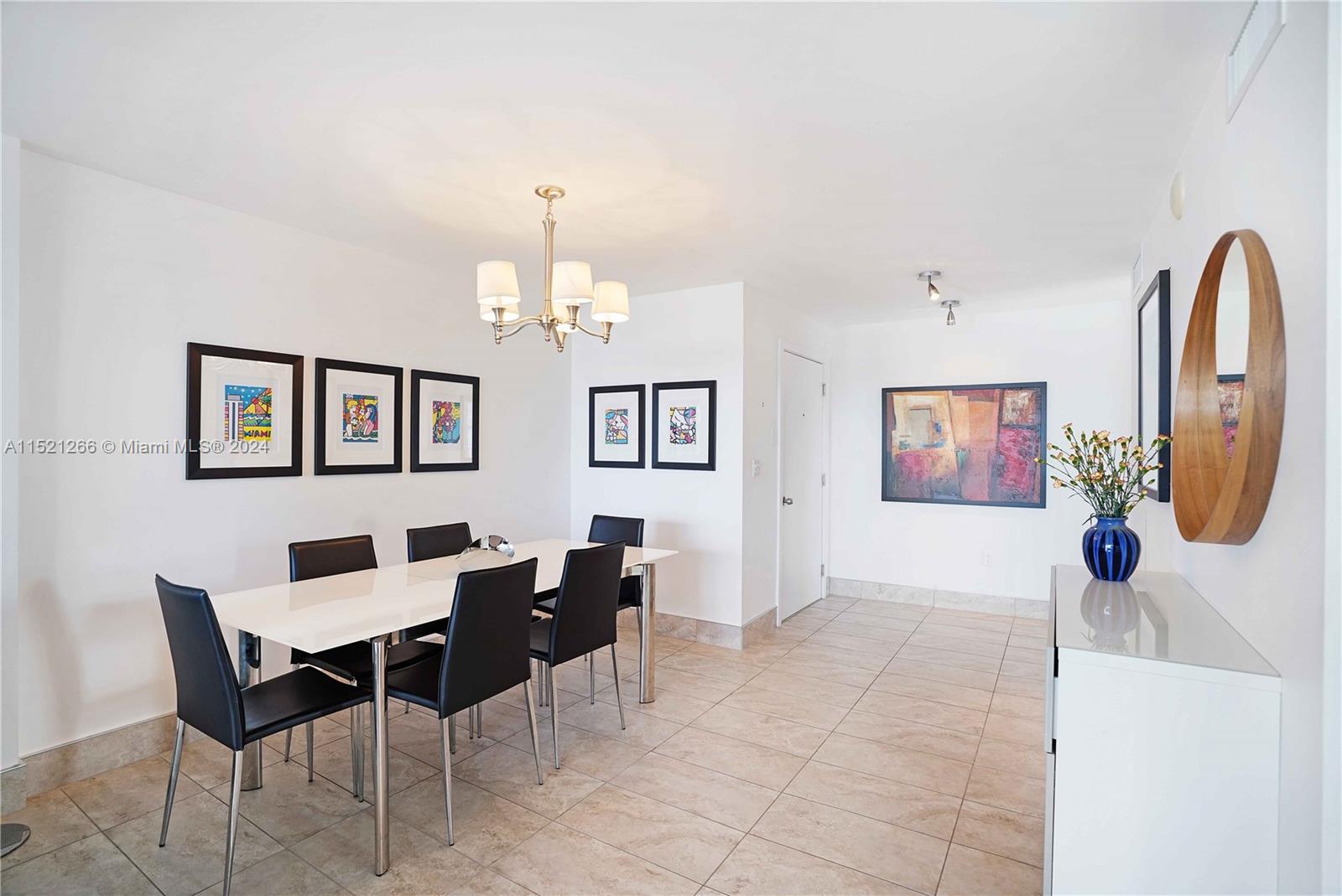 245 18th Street, Unit 902 Miami Beach, FL 33139 - Photo 24 of 54 a view of a livingroom with furniture and a chandelier