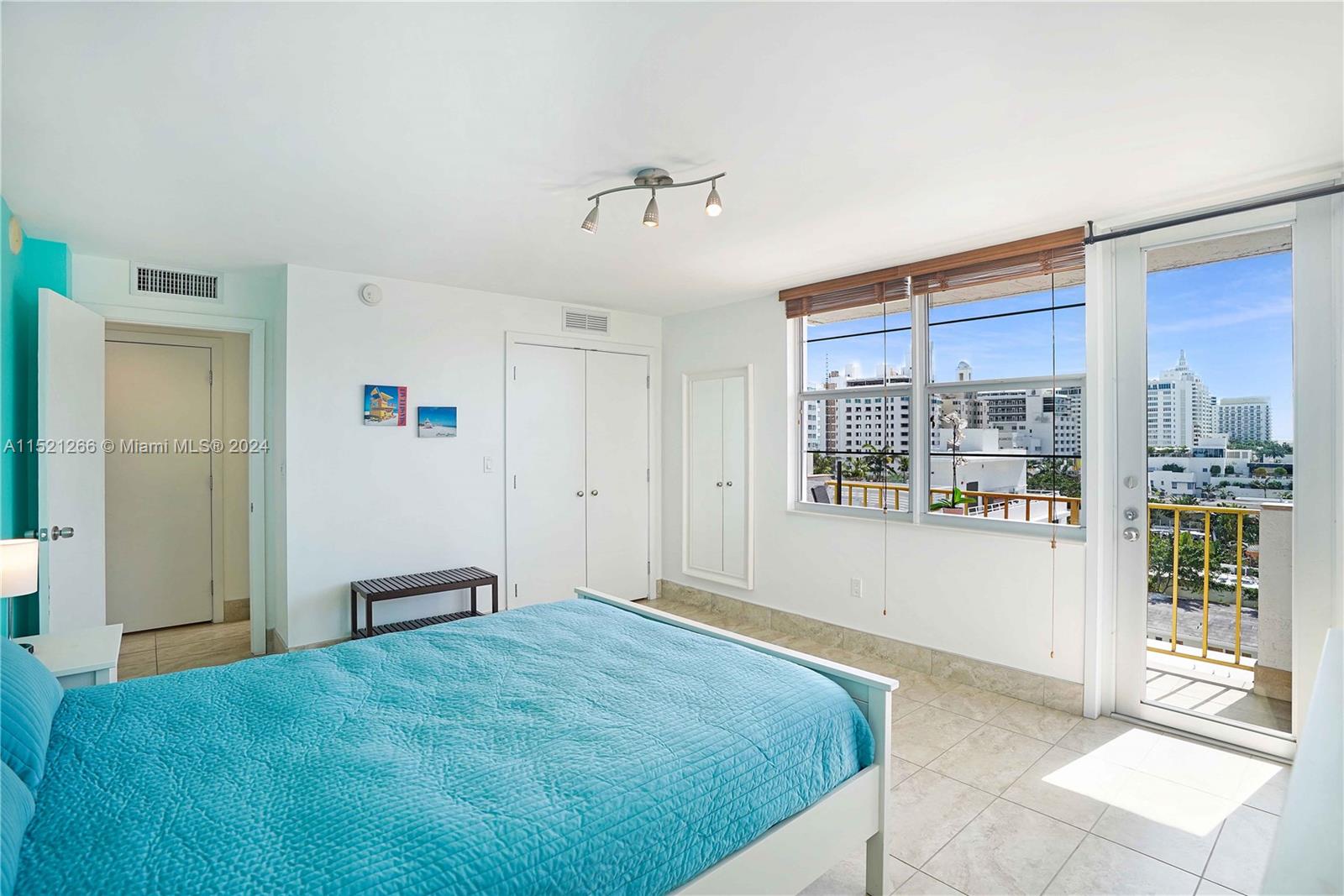 245 18th Street, Unit 902 Miami Beach, FL 33139 - Photo 37 of 54 a bedroom with a bed and a large window
