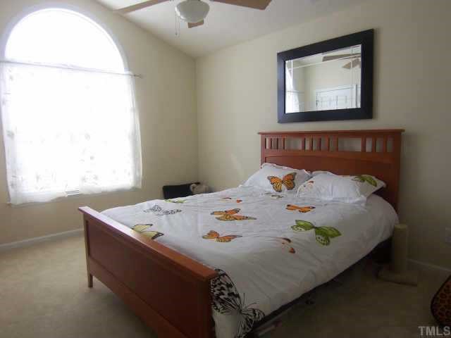 2020 Metacomet Way Raleigh, NC 27604 - Photo 11 of 12 a bed sitting in a bedroom next to a window