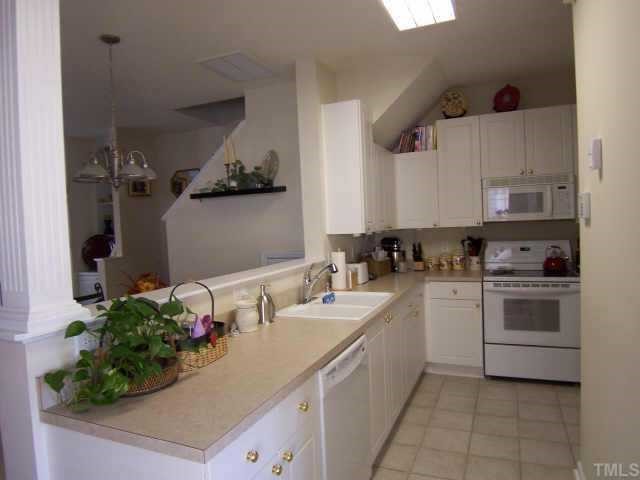 2020 Metacomet Way Raleigh, NC 27604 - Photo 3 of 12 a kitchen with a sink stove and cabinets