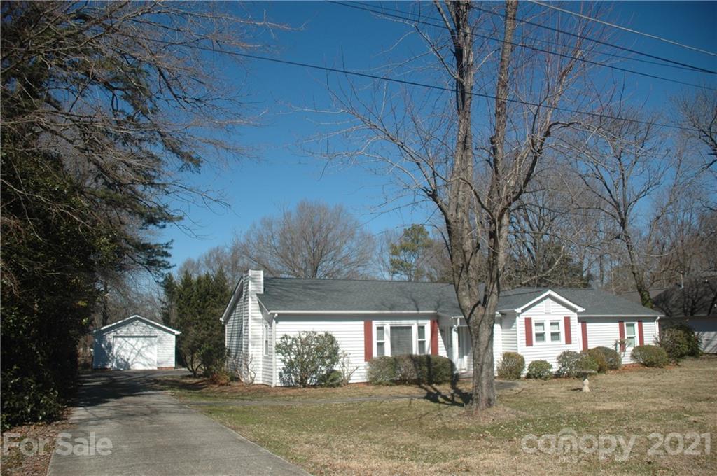 521 Gray Drive Charlotte, NC 28213 - Photo 2 of 34 a front view of a house with a yard
