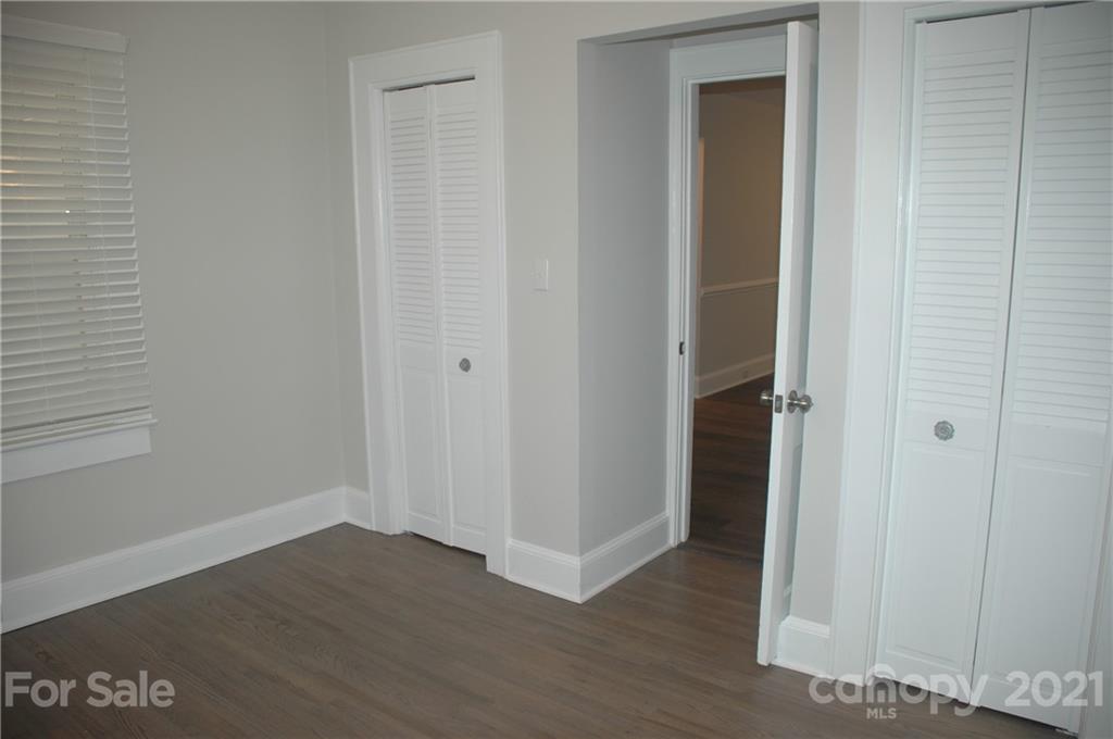 521 Gray Drive Charlotte, NC 28213 - Photo 13 of 34 a view of an empty room with wooden floor