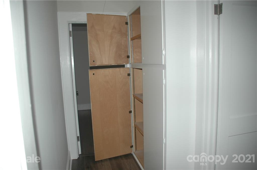 521 Gray Drive Charlotte, NC 28213 - Photo 19 of 34 a walk in closet with wooden floor